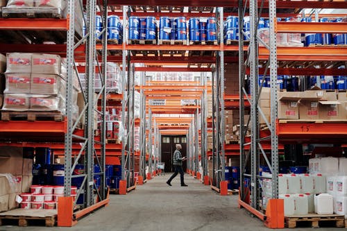 worker-walking-through-warehouse