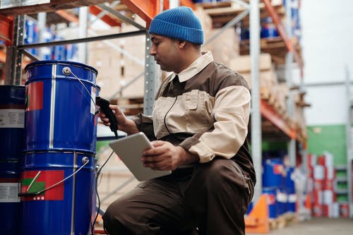 man-using-tablet-to-check-inventory