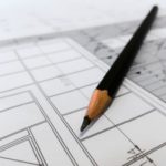 pencil-resting-on-blueprints