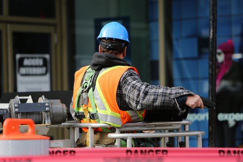 worker-in-hard-hat-facing-away-from-camera