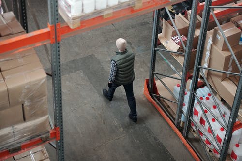 man walking through warehouse