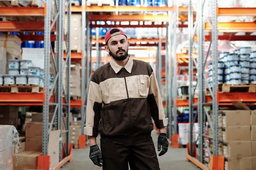 warehouse worker standing in isle