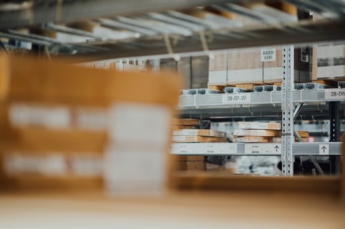 boxes stacked on metal racks