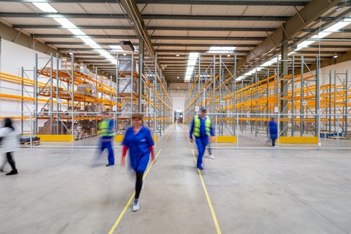 workers walking through a warehouse